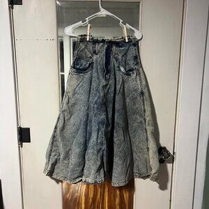 Blue denim skirt with a unique, distressed look #distresseddenim